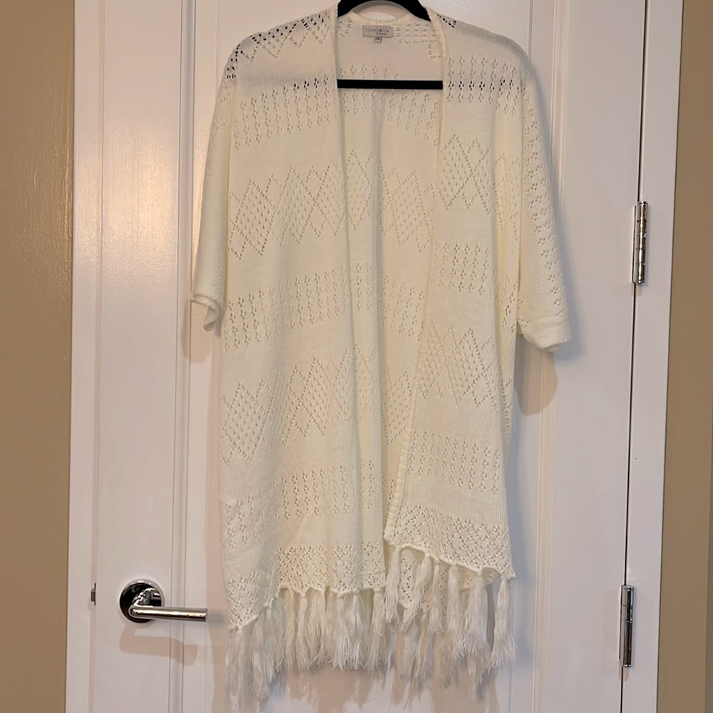 Knitted poncho like ivory sweater